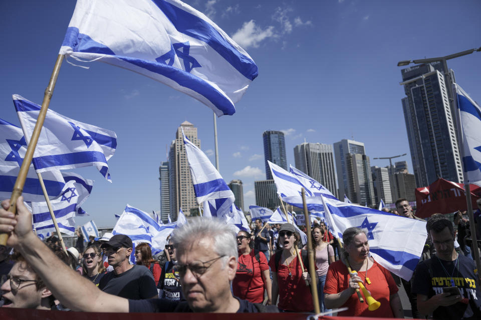 Israelis protest against plans by Prime Minister Benjamin Netanyahu's new government to overhaul the judicial system, in Tel Aviv, Israel, Thursday, March 16, 2023. (AP Photo/Oded Balilty)