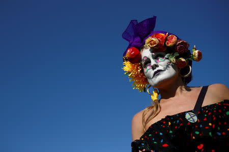 A climate change activist attends the Extinction Rebellion protest at Parliament Square in London, Britain April 21, 2019. REUTERS/Hannah McKay