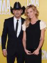 NASHVILLE, TN - NOVEMBER 01: (L-R) Country music artists Tim McGraw and Faith Hill attend the 46th annual CMA Awards at the Bridgestone Arena on November 1, 2012 in Nashville, Tennessee. (Photo by Jason Kempin/Getty Images)