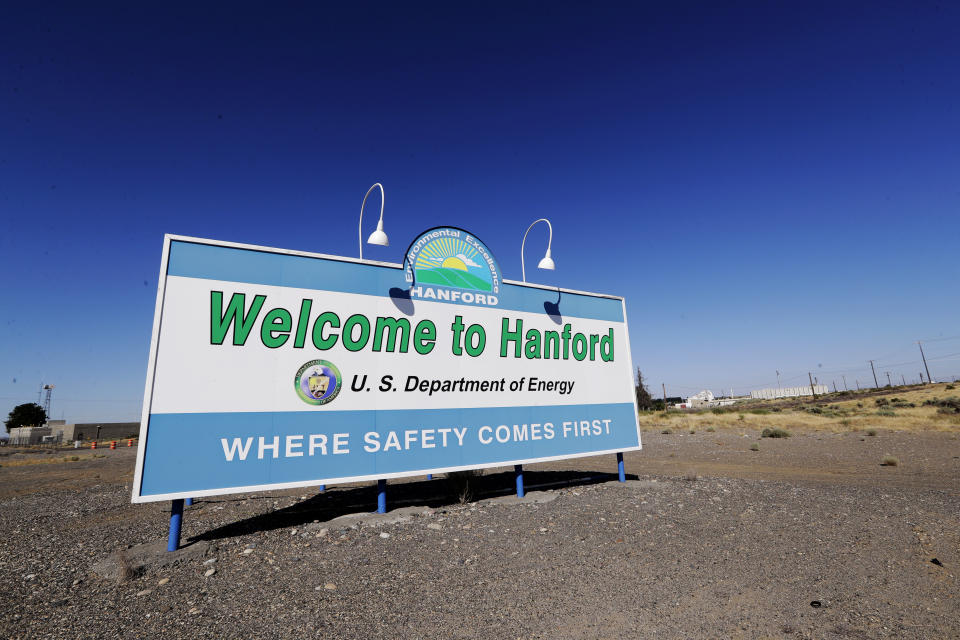 FILE - A sign at the Hanford Nuclear Reservation is posted near Richland, Wash., on Aug. 14, 2019. Three tribes have devoted decades to returning their ancestral lands in Washington to the days before they became the most radioactively contaminated site in the nation’s nuclear weapons complex. But the Yakama Nation, Confederated Tribes of the Umatilla Indian Reservation and Nez Perce Tribe have been left out of negotiations on a major decision affecting the future cleanup of millions of gallons of radioactive waste stored in underground tanks on the reservation. (AP Photo/Elaine Thompson, File)
