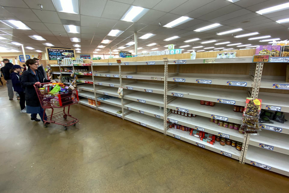 Shelves previously filled with pasta and canned food are seen empty at a Trader Joe's grocery store as shoppers gather supplies with coronavirus fears spreading in Encinitas, California, U.S., March 12, 2020.      REUTERS/Mike Blake