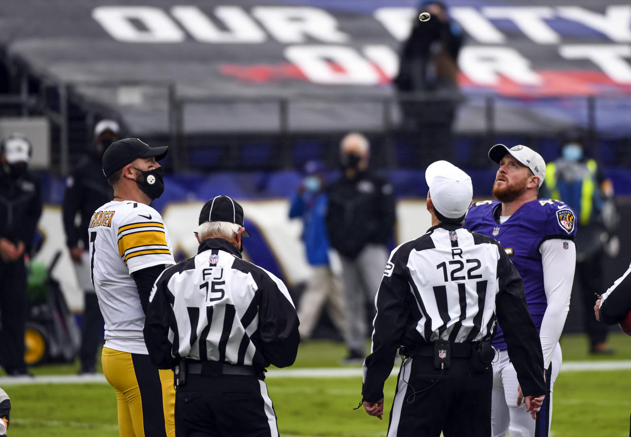 Captains look up next to referees.