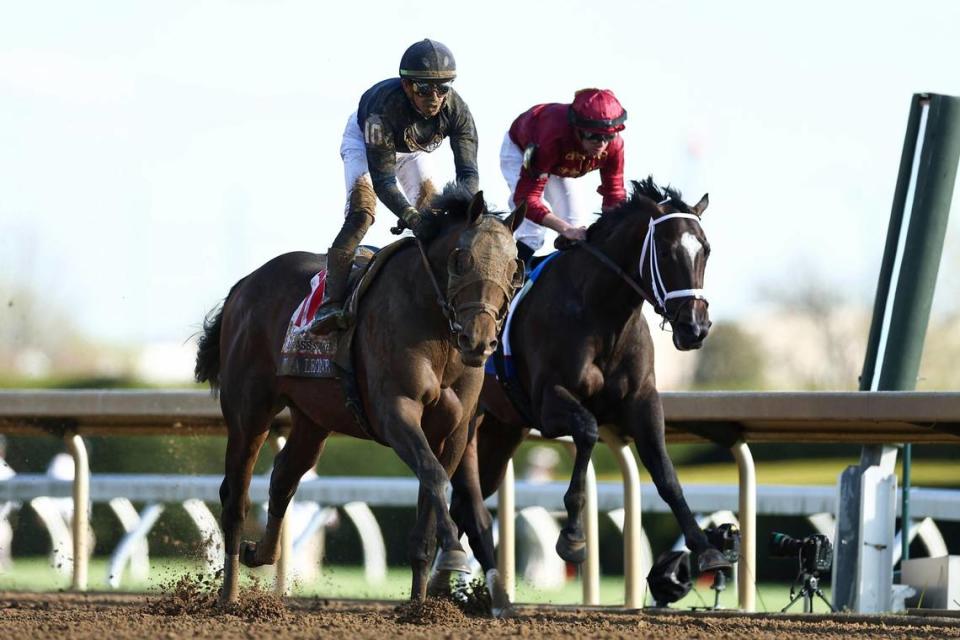 Tyler Gaffalione guides Sierra Leone, left, to victory in the Toyota Blue Grass Stakes at Keeneland on Saturday.