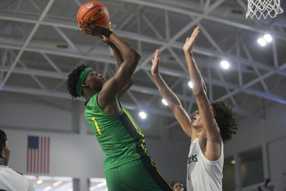 Mookie Cook from AZ Compass goes up for a shot against Long Island Lutheran during the  GEICO High School Nationals quarterfinal at Suncoast Credit Union Arena on Thursday. AZ Compass won.