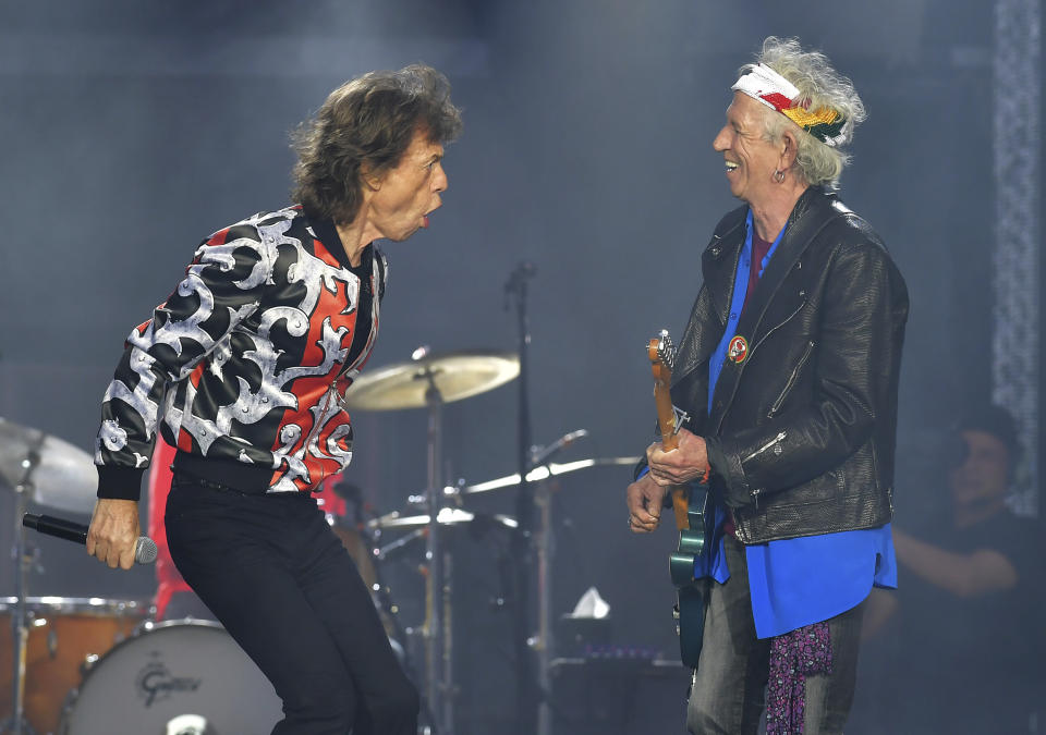 FILE - In this May 25, 2018 file photo, Mick Jagger, left, and Keith Richards, of The Rolling Stones, perform during their No Filter tour in London. The Rolling Stones will be rolling through the U.S. next year. The band says it is adding a 13-show leg to its tour in spring 2019, kicking off in Miami on April 20. (Photo by Mark Allan/Invision/AP, File)