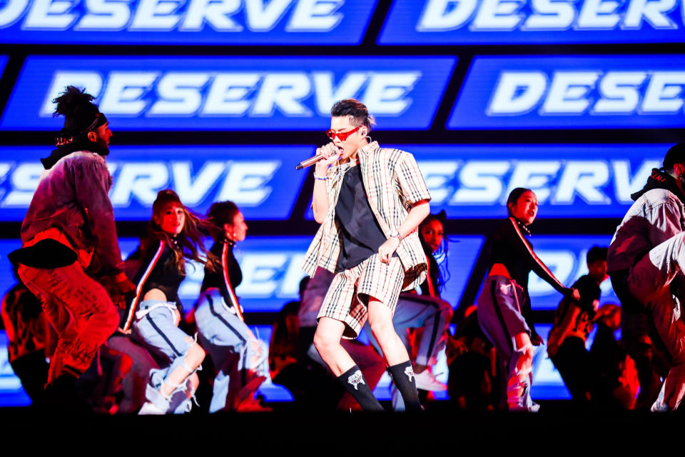 Singer Kris Wu, center, performs in the 2017 Tmall 11.11 Global Shopping Festival gala, in Shanghai, China on Nov. 10, 2017. The popular Chinese-Canadian singer, Kris Wu, has lost endorsement deals with at least 10 brands including Porsche and Louis Vuitton after a teen-ager accused him of having sex with her while she was drunk. (Chinatopix via AP)