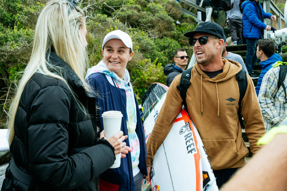 Ash Barty, pictured here chatting to Steph Gilmore and Mick Fanning at the Rip Curl Pro at Bells Beach.