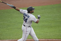 Miami Marlins' Jesus Aguilar watches two-run home run off Baltimore Orioles starting pitcher Jorge Lopez during the second inning of a baseball game Wednesday, July 28, 2021, in Baltimore. (AP Photo/Terrance Williams)