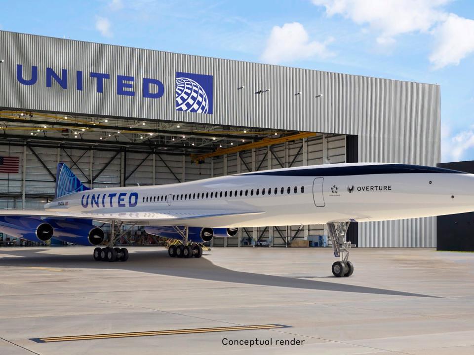 Boom Supersonic's Overture with United's branding in front of a United building.