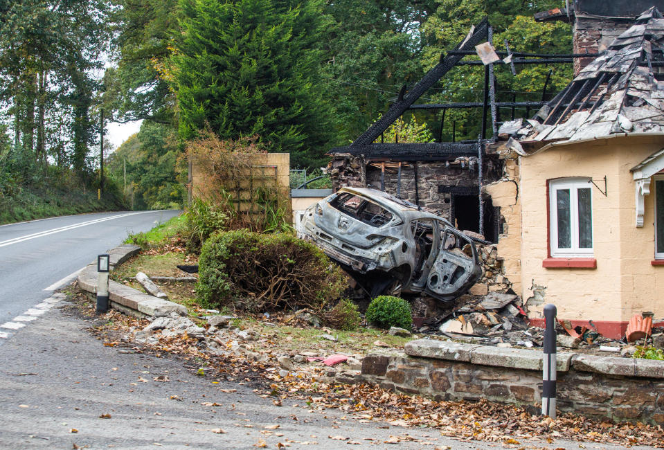 A driver has been arrested after car crashed into a house on the A38 in Cornwall. 19th October 2020  See SWNS story SWPLcrash. This dramatic picture shows the damage caused after a car crashed into a house before bursting into flames. The motorist ploughed into the home on the A38 causing both the property and car to catch fire. The roof was burned away, leaving charred beams and smoke damaged walls. The trapped driver was taken to Derriford Hospital in Plymouth, Devon, following the crash in Bodmin, Cornwall on Sunday at around 7.30pm.See SWNS story SWPLcrash. This dramatic picture shows the damage caused after a car crashed into a house before bursting into flames. The motorist ploughed into the home on the A38 causing both the property and car to catch fire. The roof was burned away, leaving charred beams and smoke damaged walls. The trapped driver was taken to Derriford Hospital in Plymouth, Devon, following the crash in Bodmin, Cornwall on Sunday at around 7.30pm.