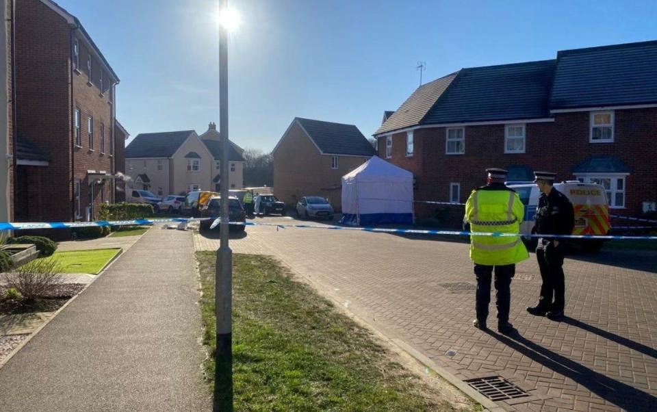 Police at the scene where the four bodies were found in Costessey, Norfolk