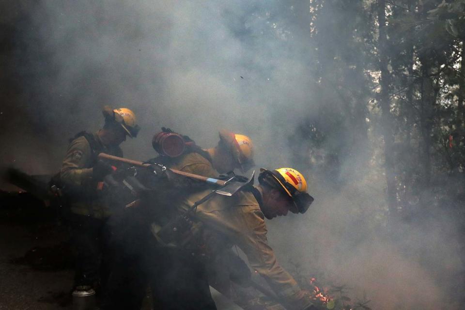 Fire crews have faced an uphill struggle to contain the blazes (AP)