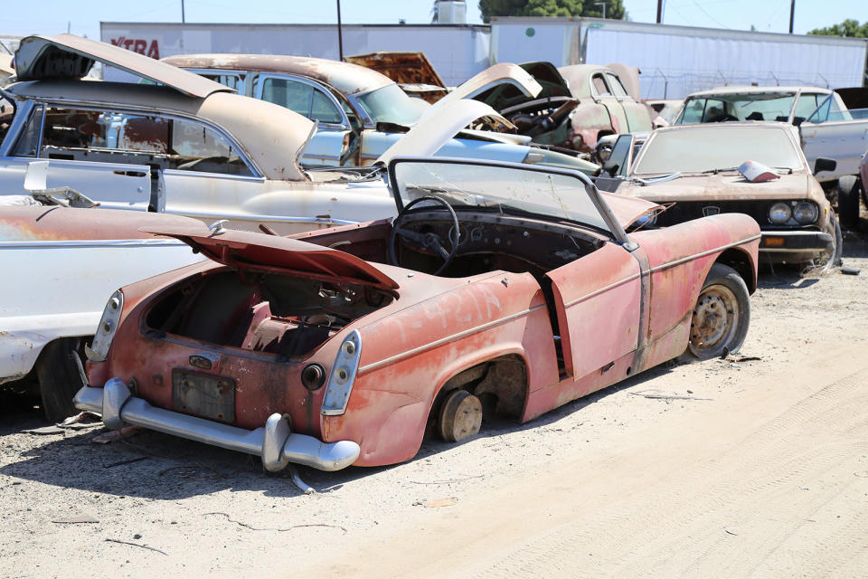 <p>The lack of external door handles instantly identifies this MG Midget as a Mk1. The doors also lacked locks, winding windows and swivelling quarterlights, all of which would make a welcome appearance in the Mk2. A total of <strong>25,681 </strong>Mk1s were built between 1961 and 1964, a mix of 948cc and later 1098cc cars. This car was also at <strong>Turner’s Auto Wrecking.</strong></p>