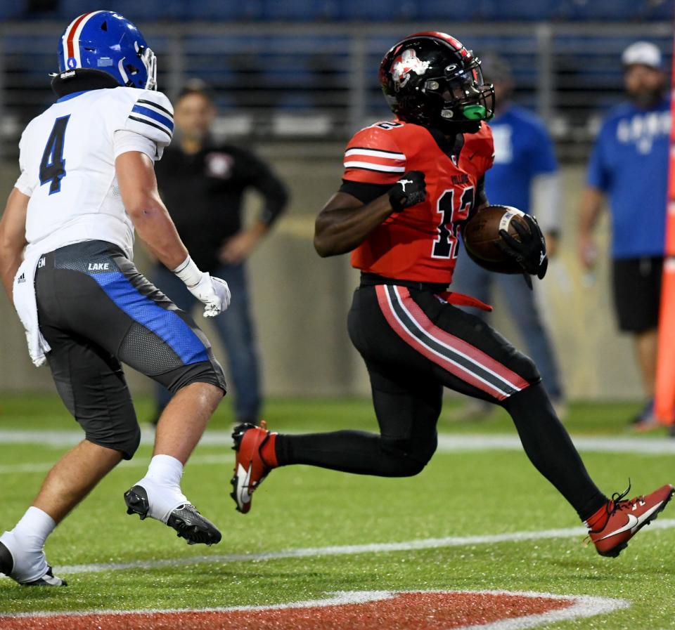 McKinley running back Nino Hill runs for a first-half touchdown against Lake, Friday, Sept 29, 2023.