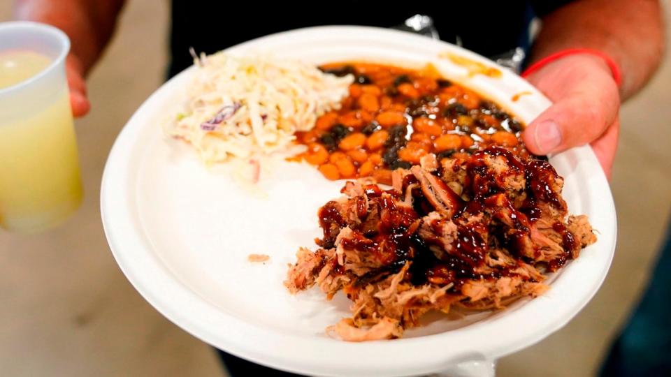 PHOTO: A plate of food is held on Aug. 6, 2023, in Cedar Rapids, Iowa. (Charlie Neibergall/AP)