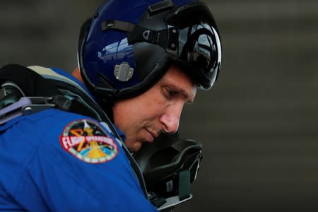 NASA commercial crew astronaut Michael Hopkins prepares his T38 plane before takeoff during a training flight in Houston, Texas