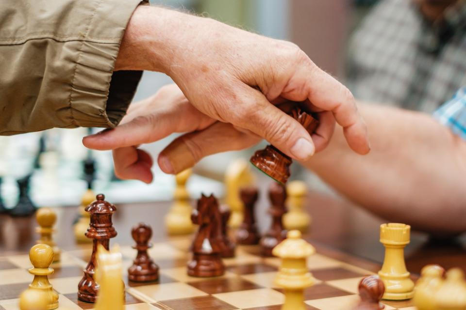 Dover residents Ralph Moreland, left,  and Bill Houghlan play chess, Wednesday, Sept. 27, at the Dover Public Library. The chess club meets from 4 to 7 p.m. Tuesdays at the library and 1 to 3 p. m. Sundays, in the food court of the New Towne Mall in New Philadelphia.