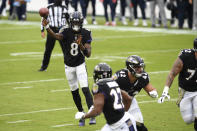 Baltimore Ravens quarterback Lamar Jackson (8) throws a pass to running back J.K. Dobbins (27) on a 2-point conversion play against the Tennessee Titans during the first half of an NFL football game, Sunday, Nov. 22, 2020, in Baltimore. (AP Photo/Nick Wass)