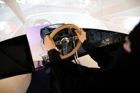 Trainee Amira Abdulgader practices on a simulator car at Saudi Aramco Driving Center in Dhahran, Saudi Arabia June 6, 2018. REUTERS/Ahmed Jadallah