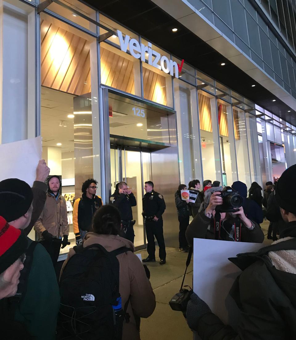 Net neutrality supporters gather at a rally in front of a Verizon store on 42nd Street in New York City on Dec. 7. (Photo: Jenna Amatulli)