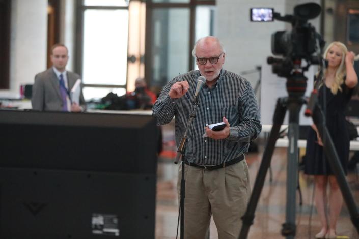 Randy Ludlow, seen here asking a question during an early coronavirus news conference by Ohio Gov. Mike DeWine on March 27, 2020, was a longtime Columbus Dispatch government reporter.