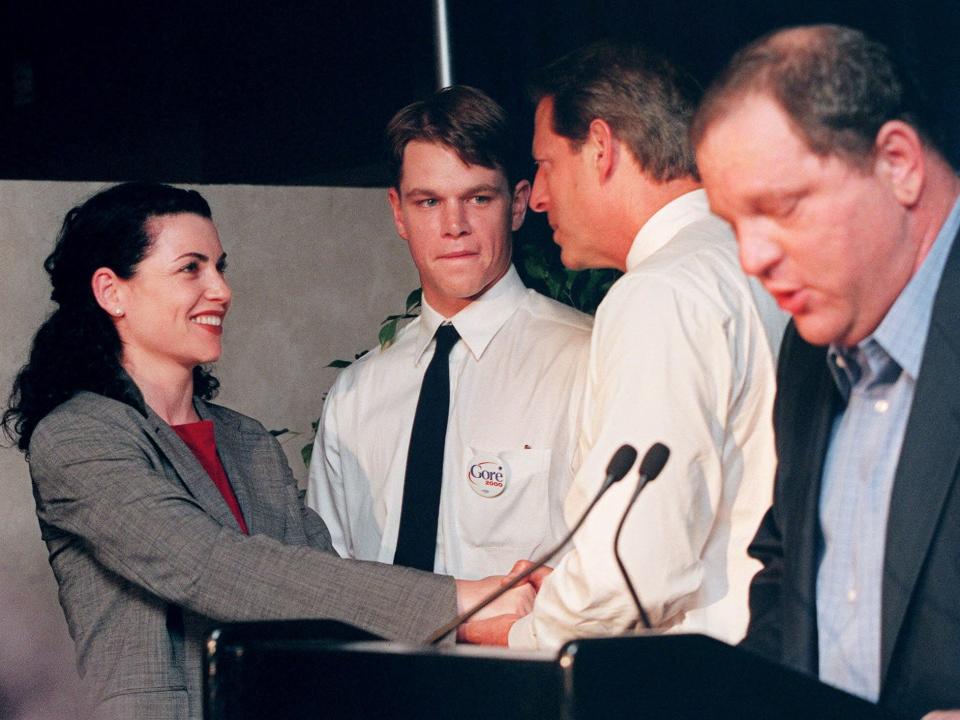 Harvey Weinstein in the foreground of a picture with actress Julianna Margulis, actor Matt Damon, and presidential candidate and Vice President Al Gore.