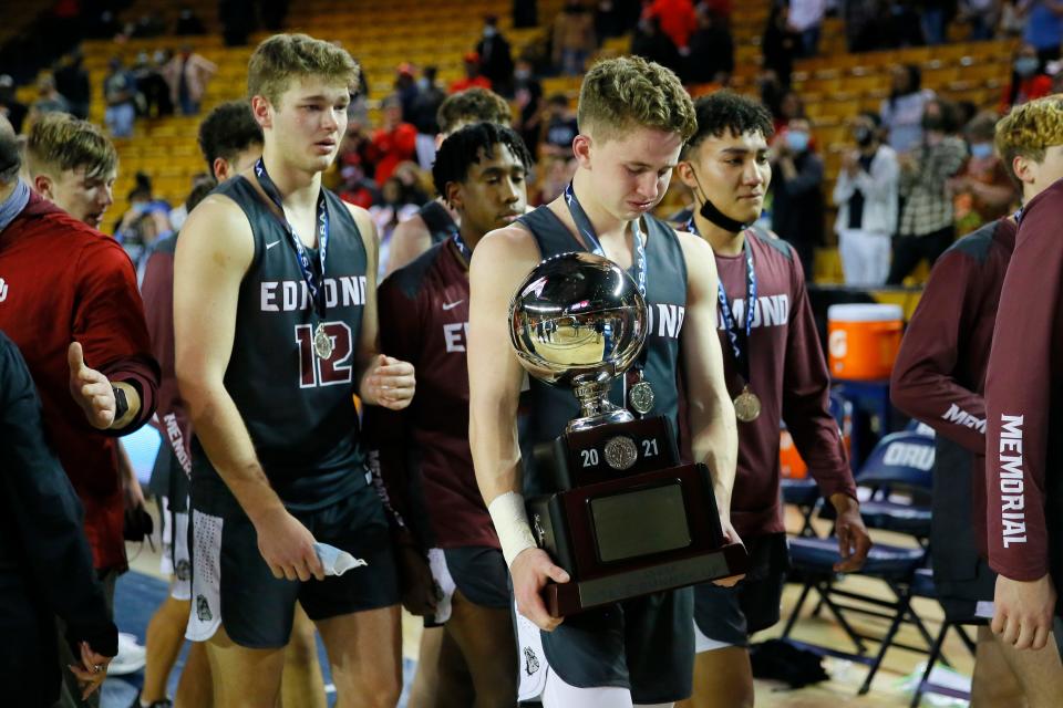Edmond Memorial's Sean Pedulla walks off the court with the runner-up trophy after the Class 6A boys state tournament championship game between Edmond Memorial and Del City at the Mabee Center in Tulsa, Saturday, March 13, 2021.