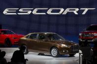 The Ford Escort sedan is unveiled during press day at the China Auto show in Beijing, China, Sunday, April 20, 2014. Ford Motor Co. on Sunday unveiled a new Escort sedan designed in China for global sale at a Beijing auto show that highlighted the growing influence of Chinese tastes on the industry. (AP Photo/Ng Han Guan)