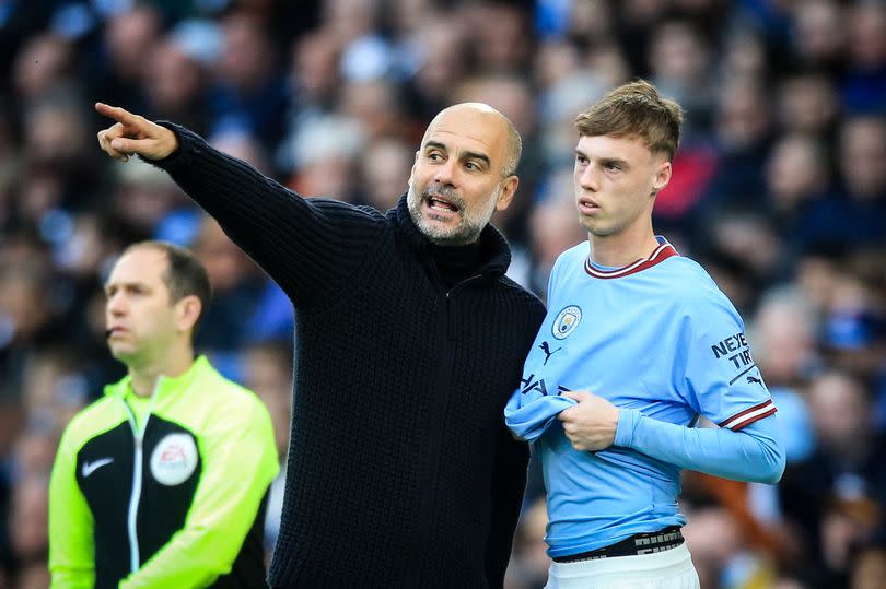 Chelsea attacker Cole Palmer with Pep Guardiola at Manchester City