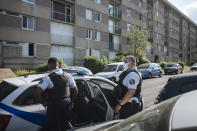 Police officers patrol in the Paris suburb of Sarcelles, Tuesday, June, 15, 2021. On their patrols through the northern Paris suburbs of Sarcelles, Villiers-le-Bel and their surroundings, officers make a point of regularly driving past – and sometimes stopping – at street corners and neighborhoods that they have identified as hotspots for drug dealing and other crimes. Officers say they want to make clear to inhabitants that there are no 'no-go zones' for the law. (AP Photo/Lewis Joly)