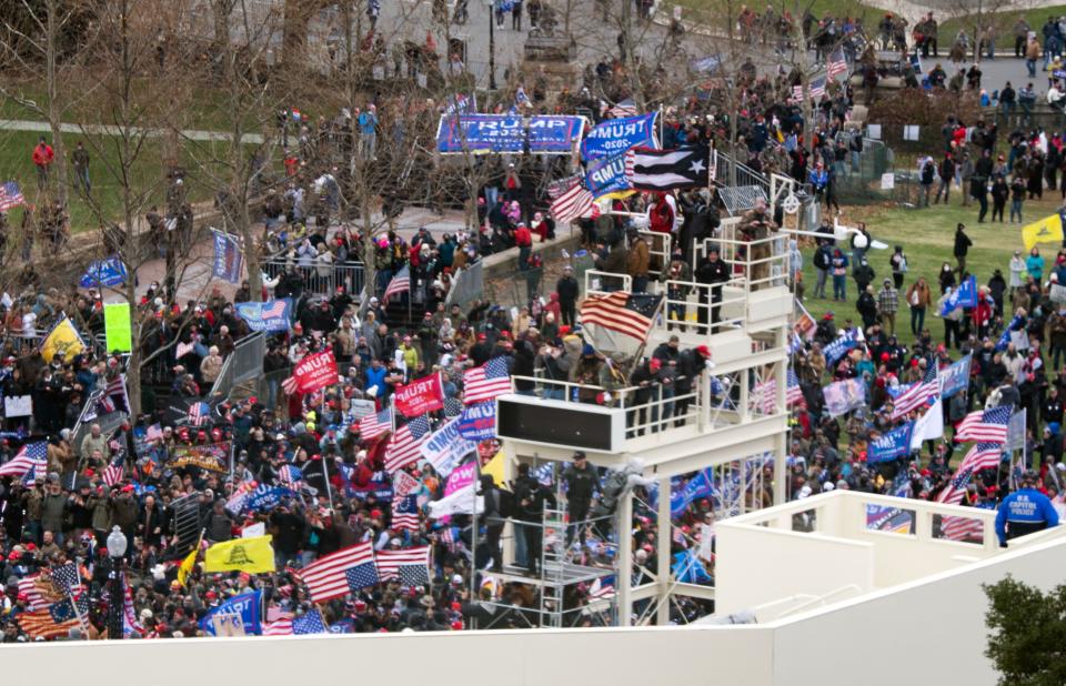 Supporters of President Donald Trump take over stands set up for the presidential inauguration as they protest at the US Capitol in Washington, DCAFP via Getty Images