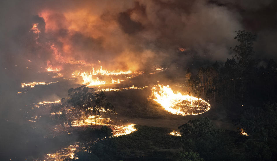 This Monday, Dec. 30, 2019 photo provided by State Government of Victoria shows wildfires in East Gippsland, Victoria state, Australia. Wildfires burning across Australia's two most-populous states trapped residents of a seaside town in apocalyptic conditions Tuesday, Dec. 31, and were feared to have destroyed many properties and caused fatalities. (State Government of Victoria via AP)