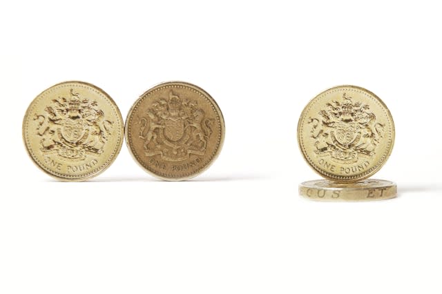 Four pound coins isolated on white