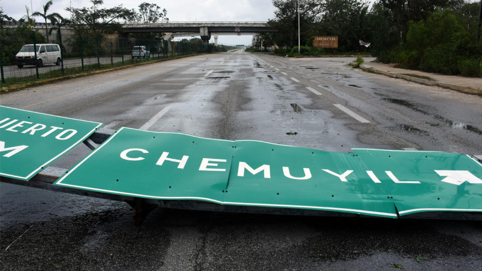 The force of Hurricane Grace knocked down road signs along Mexico's eastern Yucatan Peninsula