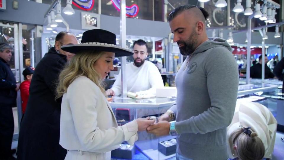 PHOTO: Julia Azeroual talks with a customer about jewelry. (ABC News)