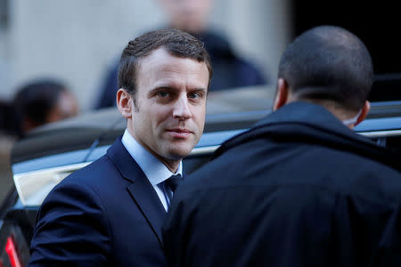 Emmanuel Macron, head of the political movement En Marche !, or Onwards !, and candidate for the 2017 presidential election, leaves his home in Paris, France, May 2, 2017. REUTERS/Benoit Tessier