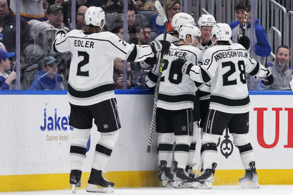 The Los Angeles Kings celebrate after right wing Arthur Kaliyev scored against the New York Islanders during the second period of an NHL hockey game Friday, Feb. 24, 2023, in Elmont, N.Y. (AP Photo/Mary Altaffer)