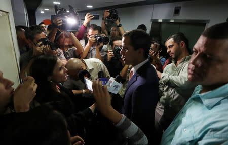 Venezuelan opposition leader Juan Guaido, who many nations have recognised as the country's rightful interim ruler, leaves after a news conference in Caracas, Venezuela May 9, 2019. REUTERS/Ivan Alvarado