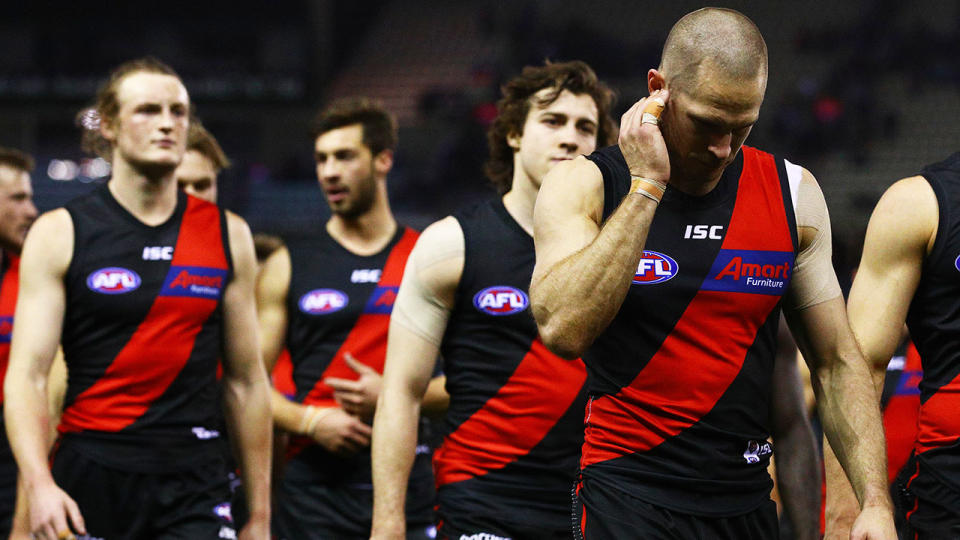 The Bombers look dejected following their 104-point drubbing at the hands of the Western Bulldogs. (Photo by Graham Denholm/Getty Images)