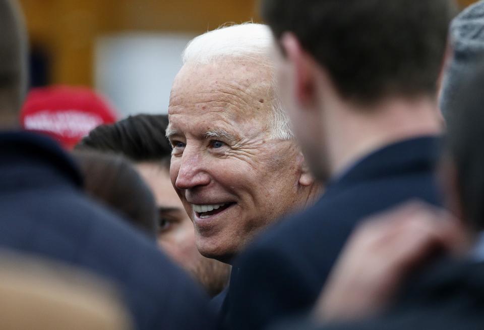 Former vice president Joe Biden talks with officials after speaking at a rally in support of striking Stop & Shop workers in Boston, Thursday, April 18, 2019. (AP Photo/Michael Dwyer)