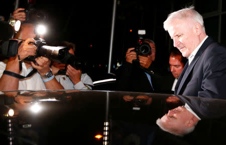 German Interior Minister Horst Seehofer leaves a Christian Social Union (CSU) leadership meeting in Munich, Germany July 2, 2018. REUTERS/Michaela Rehle