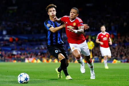 Football - Manchester United v Club Brugge - UEFA Champions League Qualifying Play-Off First Leg - Old Trafford, Manchester, England - 18/8/15 Manchester United's Memphis Depay in action with Club Brugge's Dion Cools Reuters / Darren Staples Livepic EDITORIAL USE ONLY.