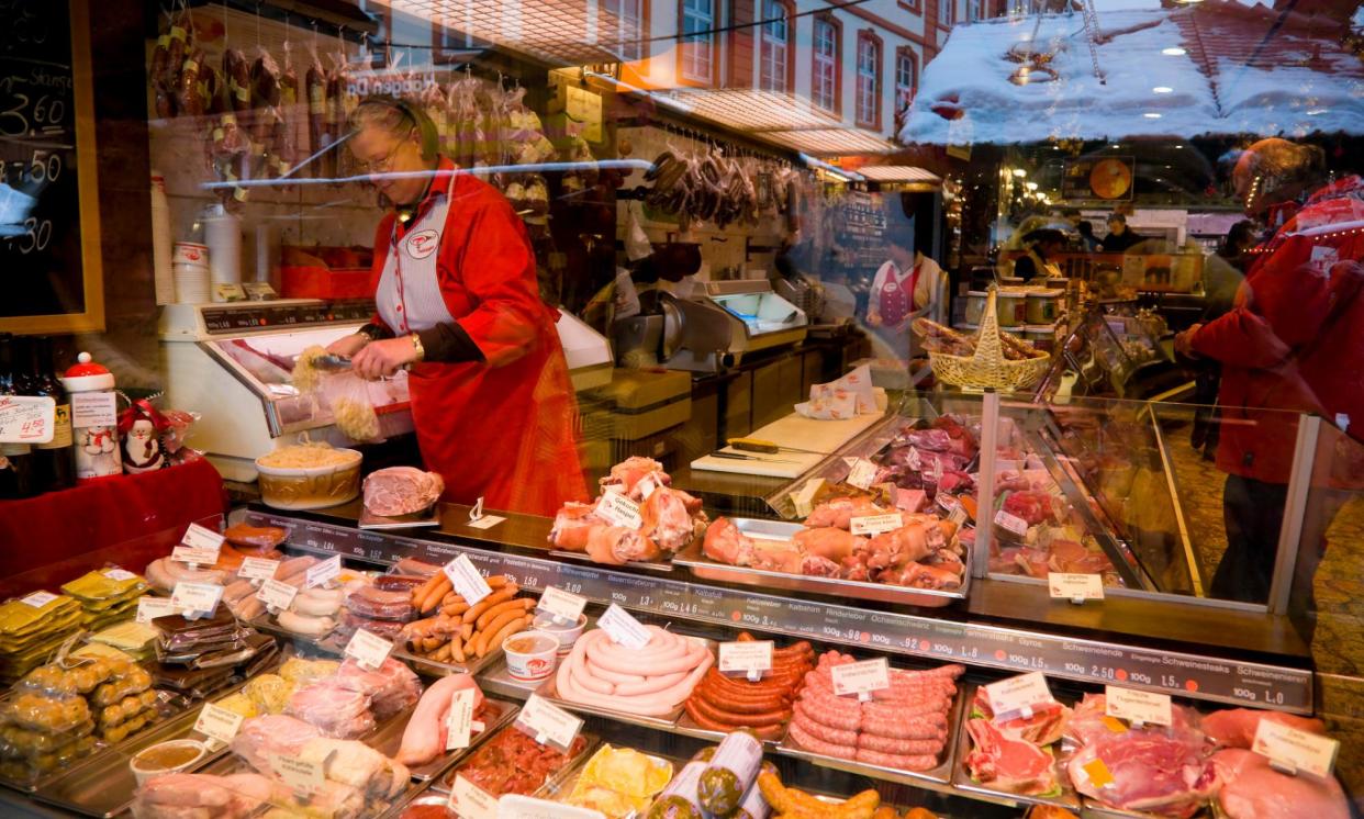 <span>A meat stall at a Christmas market in Frankfurt. A survey last year found 20% of Germans eat meat every day, down from 34% in 2015.</span><span>Photograph: AnkNet/Getty Images</span>