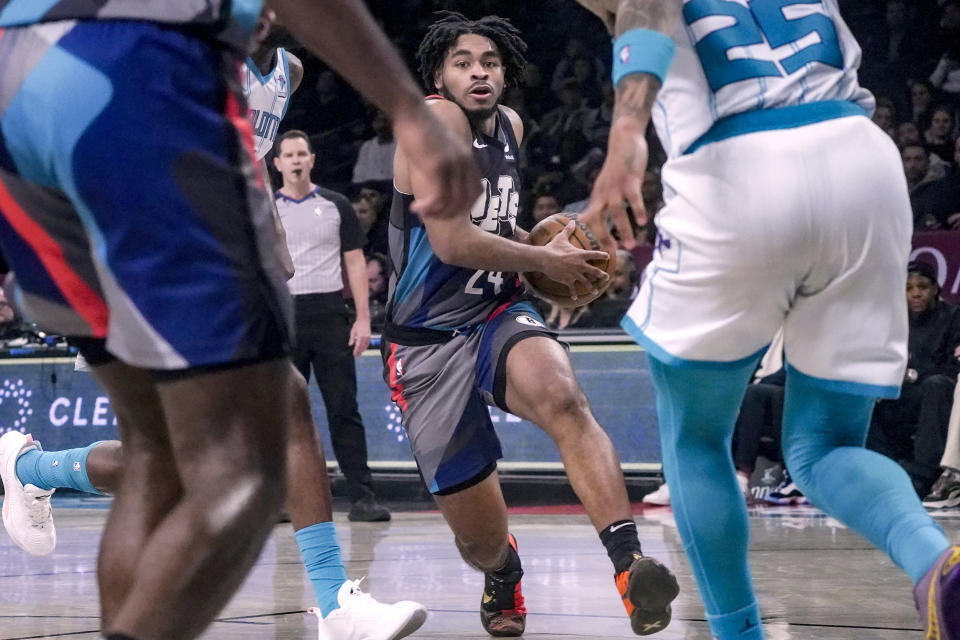 Brooklyn Nets' Cam Thomas drives to the basket during an NBA basketball game against the Charlotte Hornets, Thursday, Nov. 30, 2023, in New York. (AP Photo/Bebeto Matthews)