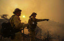 <p>Firefighters keep watch a wildfire near Placenta Canyon Road in Santa Clarita, Calif., July 24, 2016.(AP Photo/Ringo H.W. Chiu)</p>