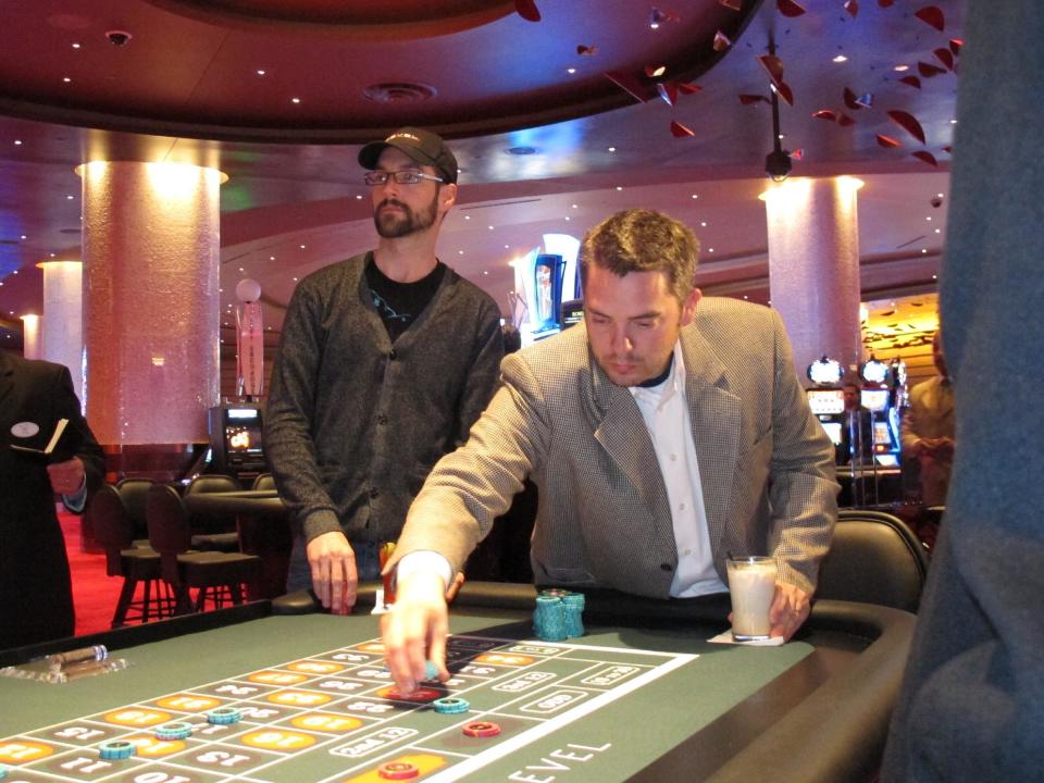 Keith Groff, left, and Jerry Colonna play roulette at Revel, the $2.4 billion casino resort, Monday, April 2, 2012, in Atlantic City, N.J. Colonna was the first customer through the doors when the casino opened Monday, and walked away from the table up $1,500 after just 10 minutes of gambling. (AP Photo/Wayne Parry)