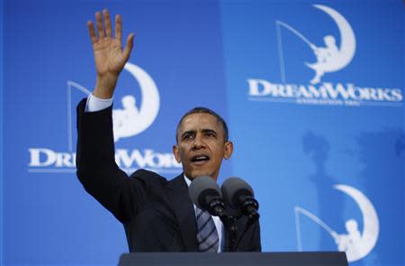 U.S. President Barack Obama waves after speaking to workers on the economy at DreamWorks Animation in Glendale, California, November 26, 2013. REUTERS/Jason Reed