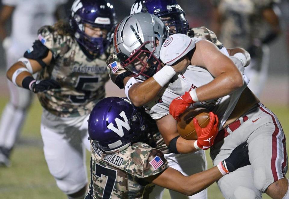 Washington Union’s defense swarms over Torres running back Joseph Bass Friday, Sept. 1, 2023 in Easton.