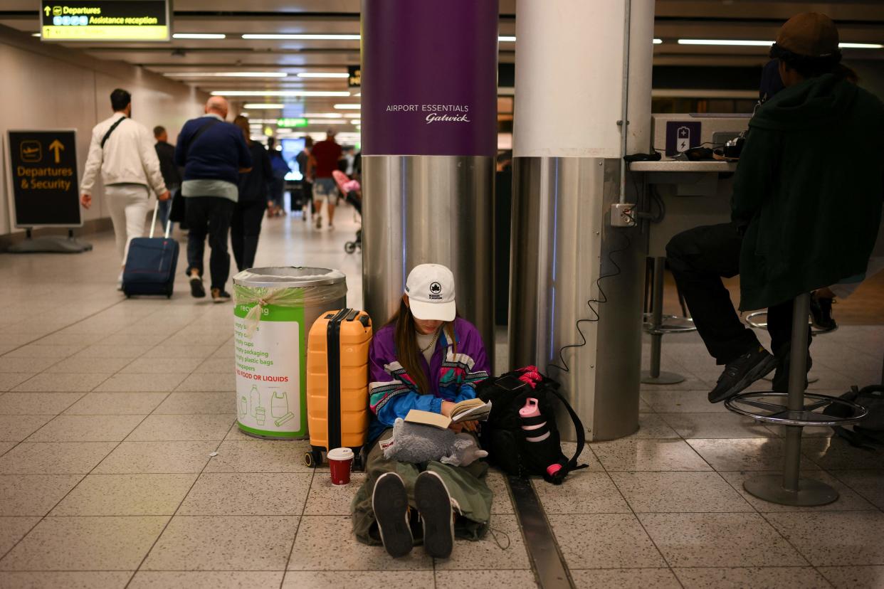 Passengers wait at Gatwick Airport, 29 August 2023 (AFP via Getty Images)