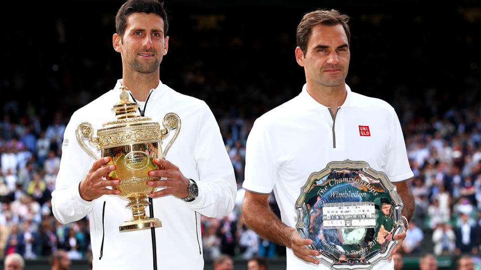 Novak Djokovic and Roger Federer after the epic Wimbledon final. (Photo by Clive Brunskill/Getty Images)